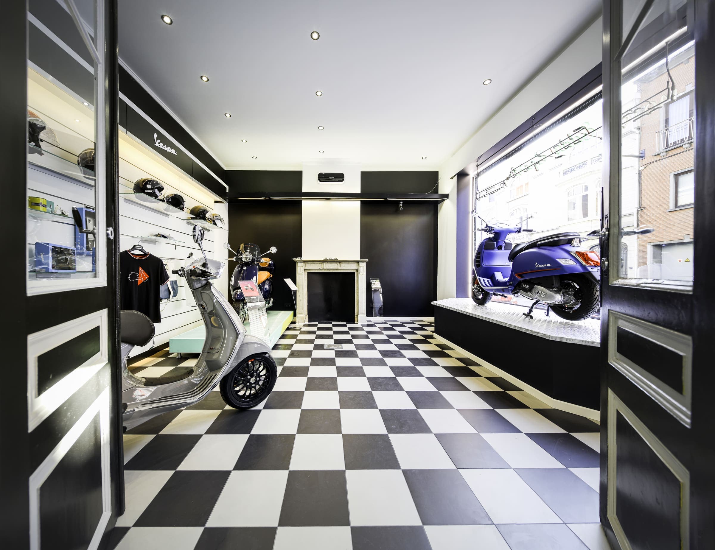 The Eddy Sport showroom, Vespa scooters on a black and white checkered floor